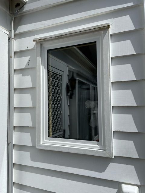 A White House with a Window on the Side of it — Lower Hutt, NZ — Complete Aluminium Maintenance Ltd