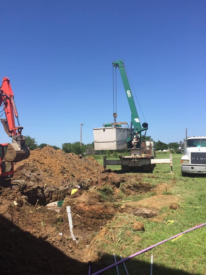 A construction site with a truck and a crane.