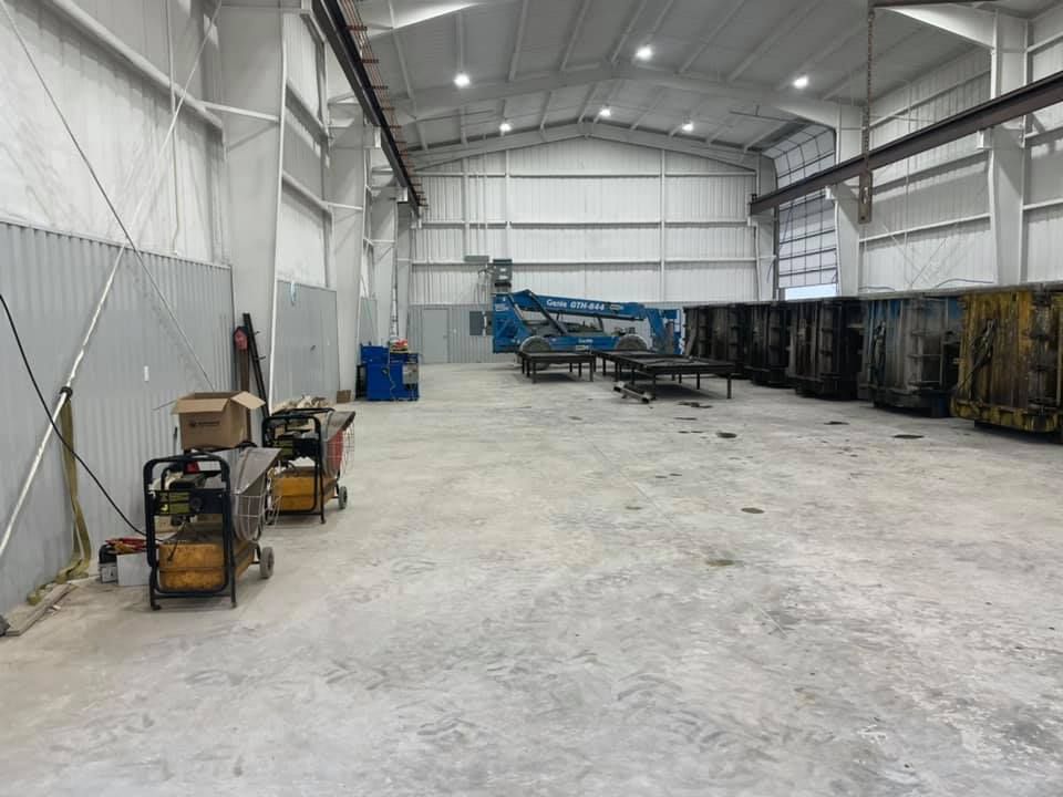 A large warehouse with a lot of machinery in it