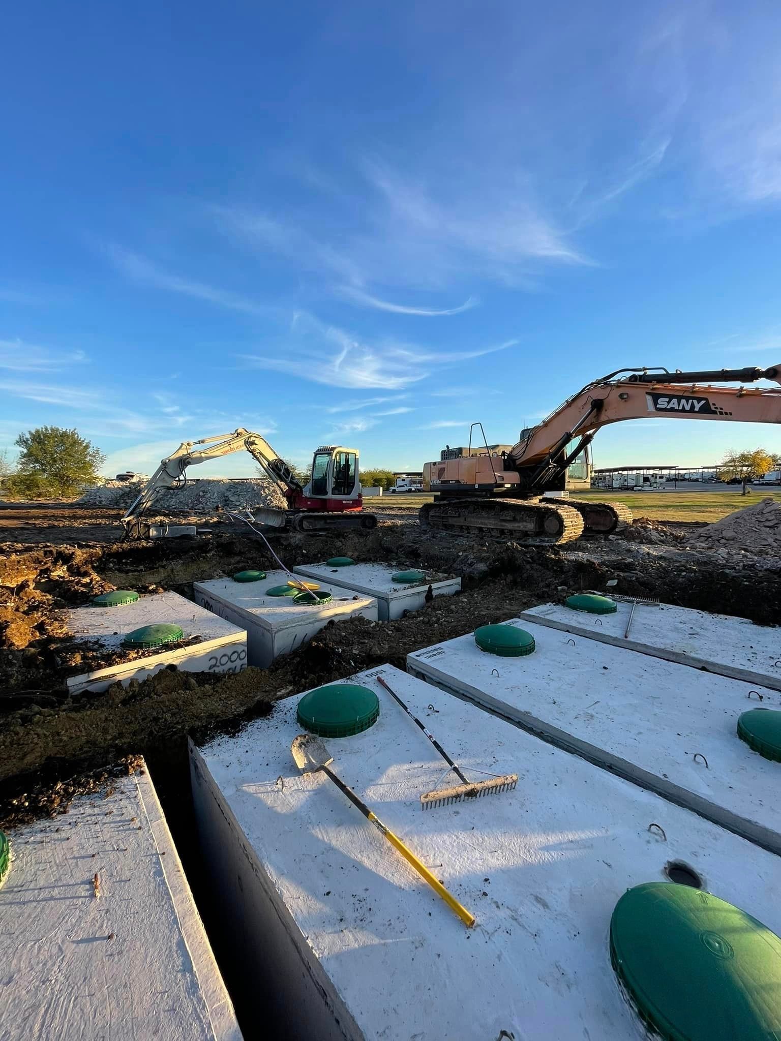 A large excavator is working on a construction site.