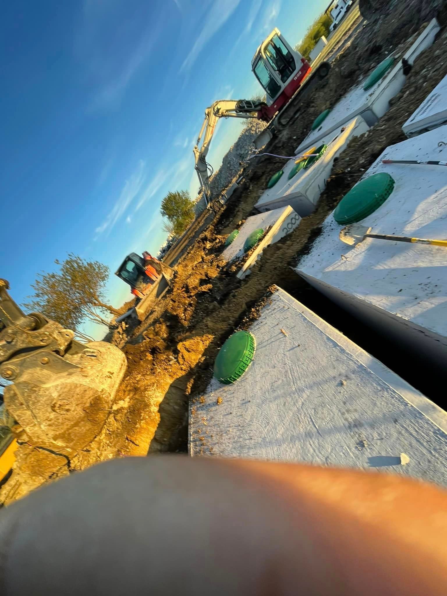 A person is taking a picture of a construction site.