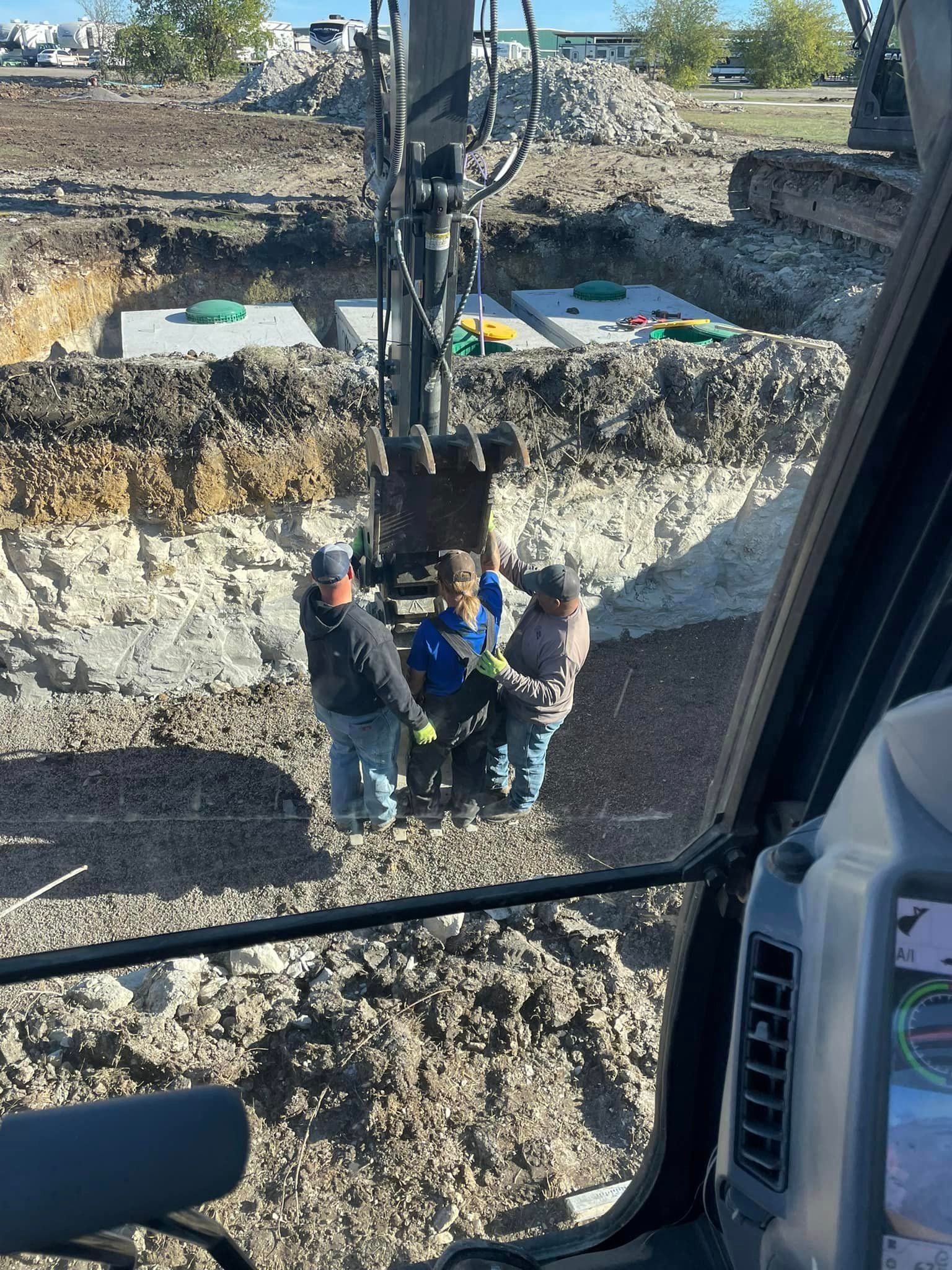 A group of construction workers are working on a construction site.
