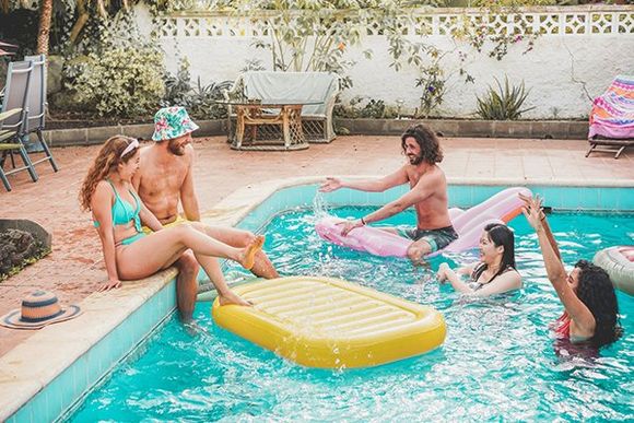 Group of Happy Friends in Pool — St. Augustine, FL — Alegro Pool Care