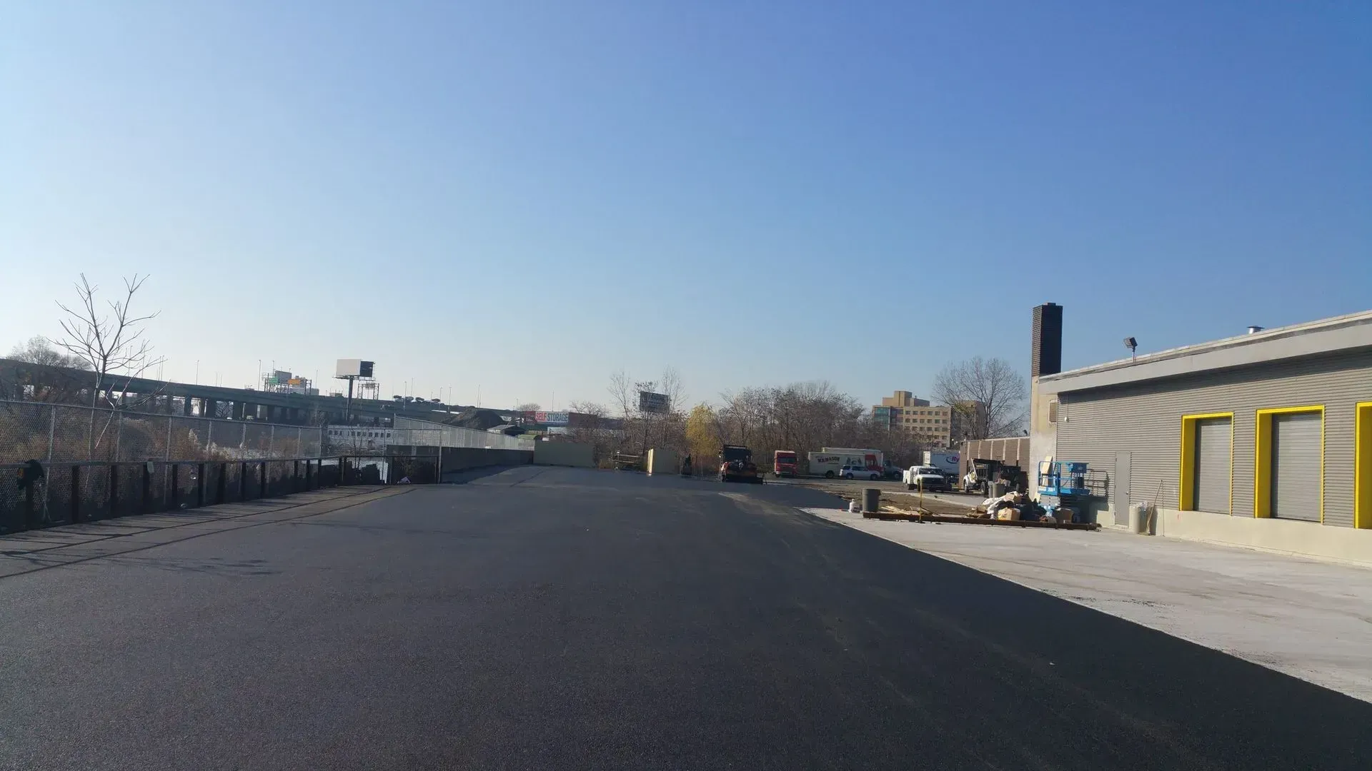 A road with a building on the side of it.