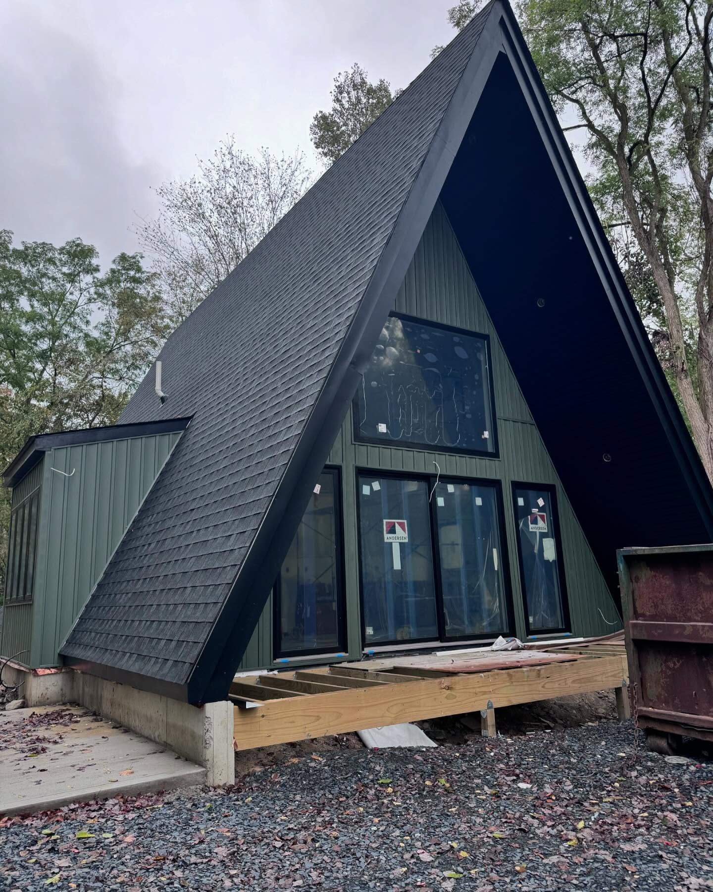 Bright, modern living room with neutral colors, hardwood floors, and a view of a fireplace.
