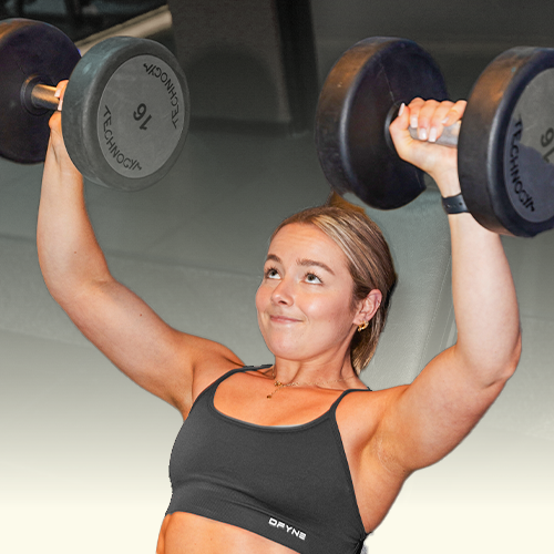 Natasja is lifting a dumbbell with the number 18 on it