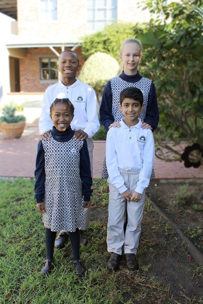 a group of children are posing for a picture together