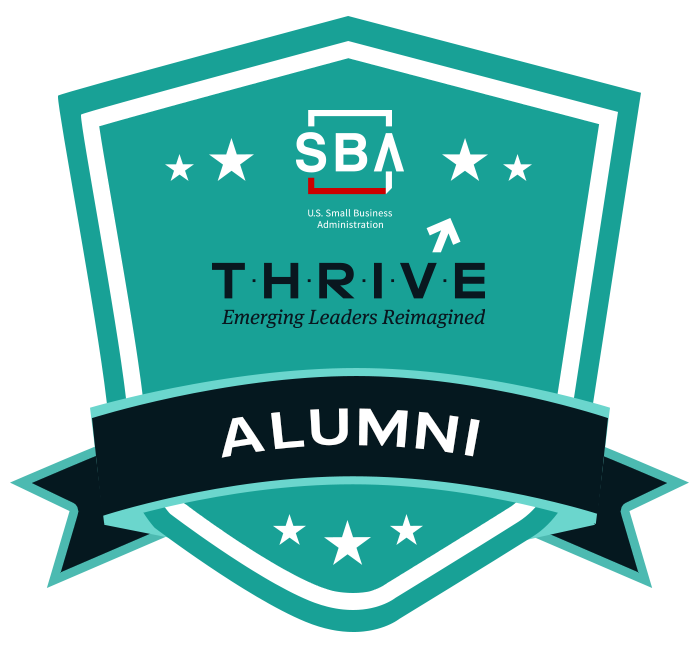 A badge that says thrive alumni on it