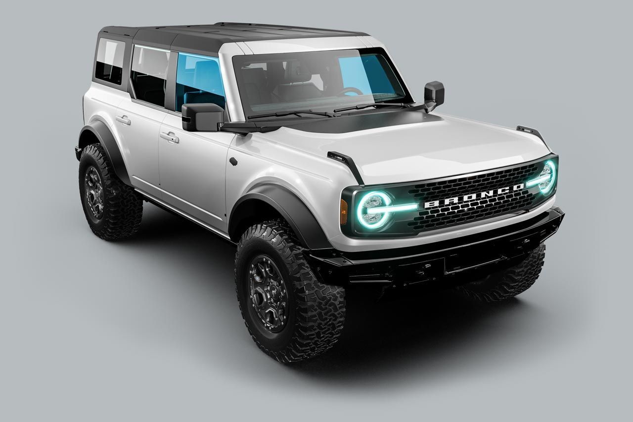 White Ford Bronco SUV with black accents, on a gray background.