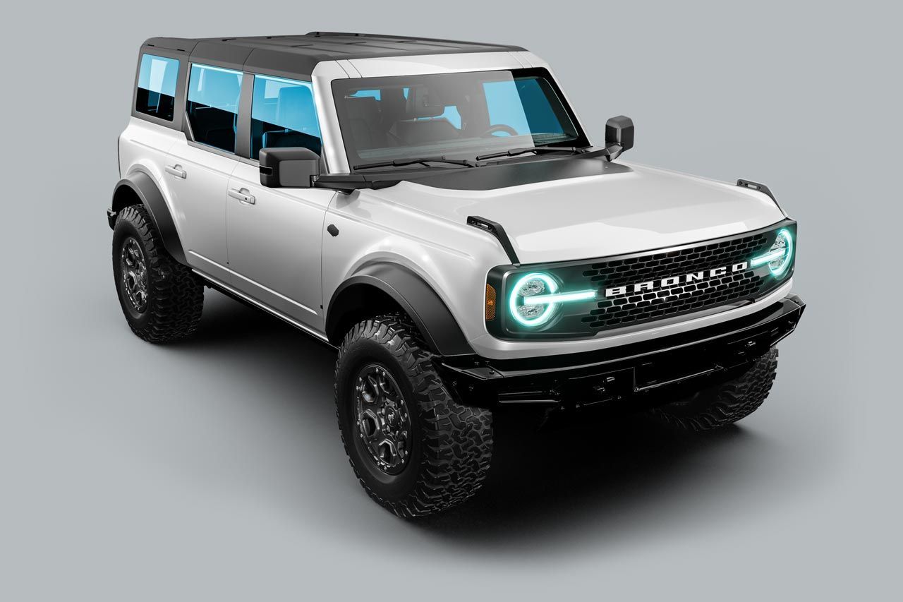 White Ford Bronco SUV with black accents, on a grey background.