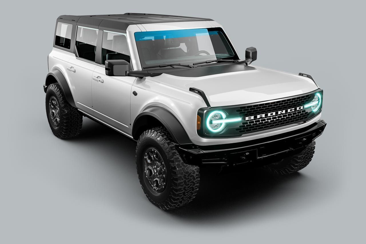 White Ford Bronco SUV with black accents, on a gray background.