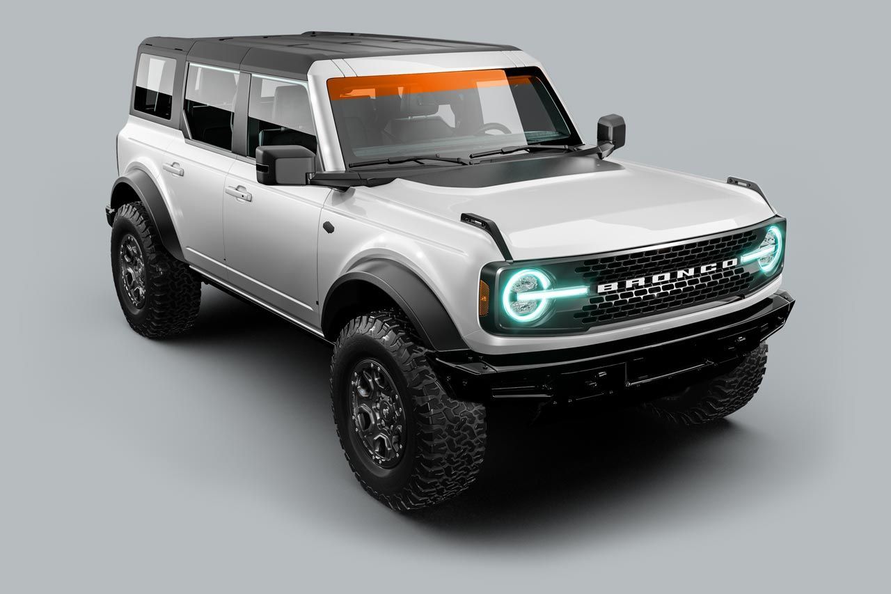 White Ford Bronco SUV with black accents and off-road tires.