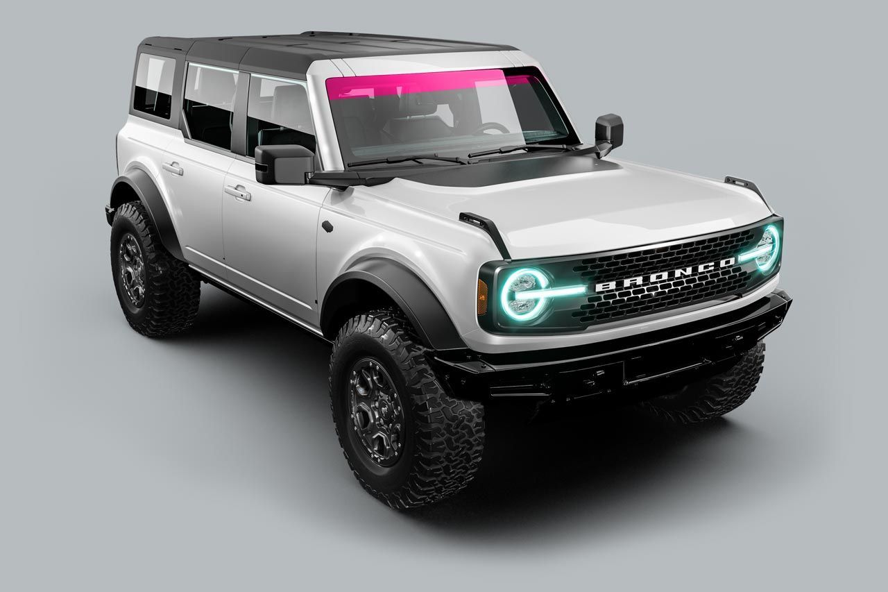 White Ford Bronco SUV with black accents and off-road tires, on a gray background.