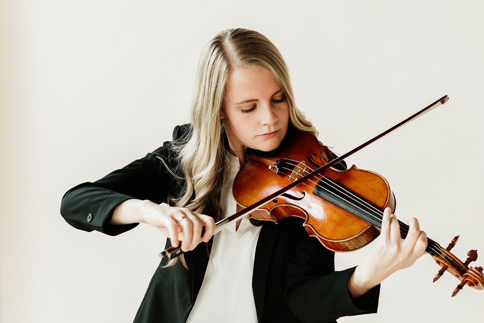 Karen Ferry is playing violin.