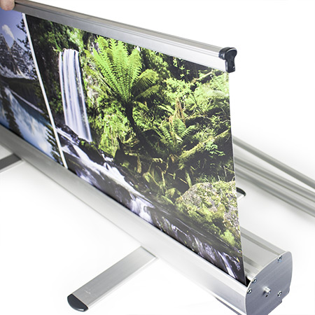 A roll up banner with a picture of a waterfall on it — Quality Printing In Port Douglas, QLD