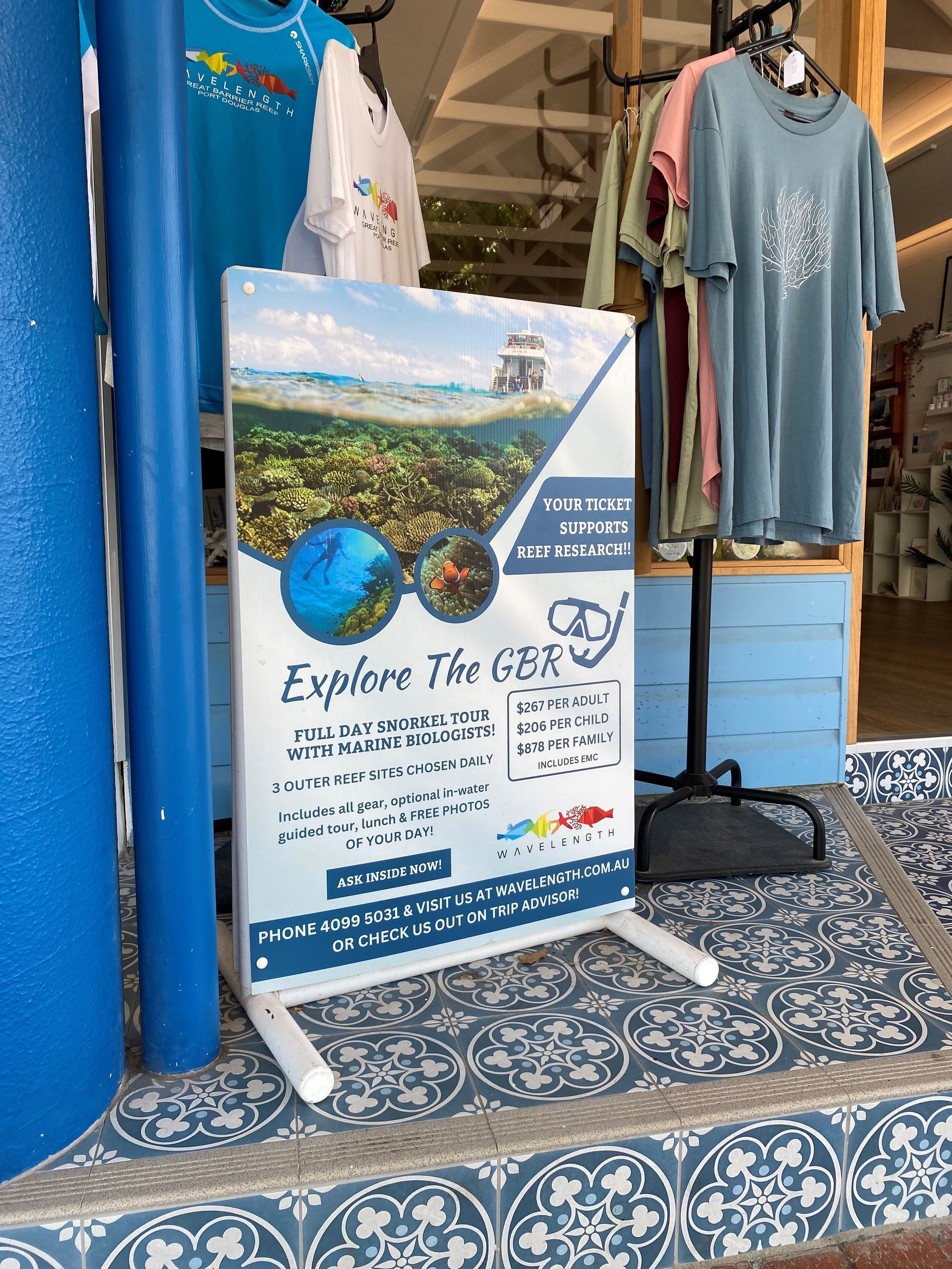 A Sign That Says Explore The Gps Is In Front Of A Store — Quality Printing In Port Douglas, QLD