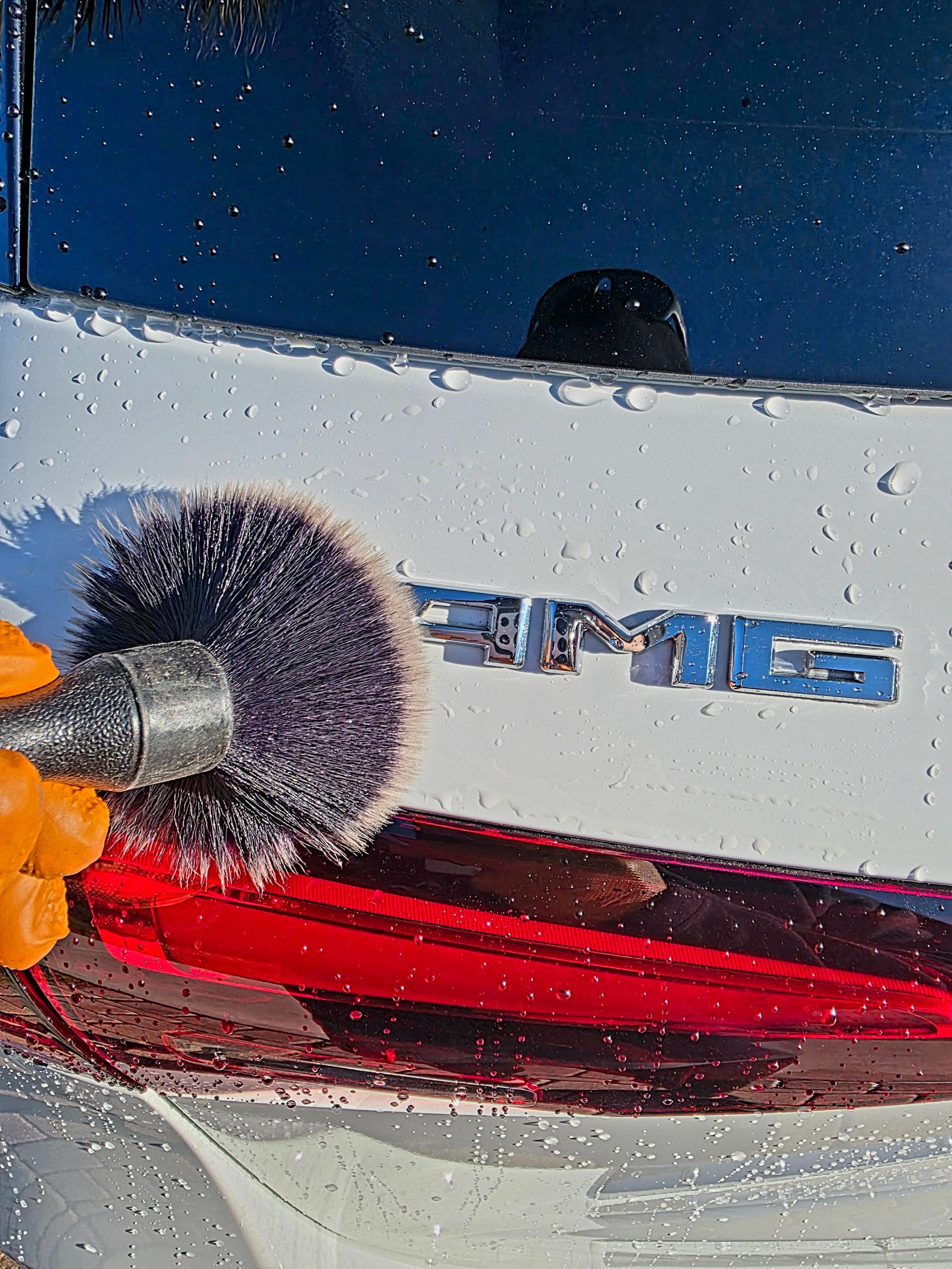 A yellow sports car is parked in a garage.