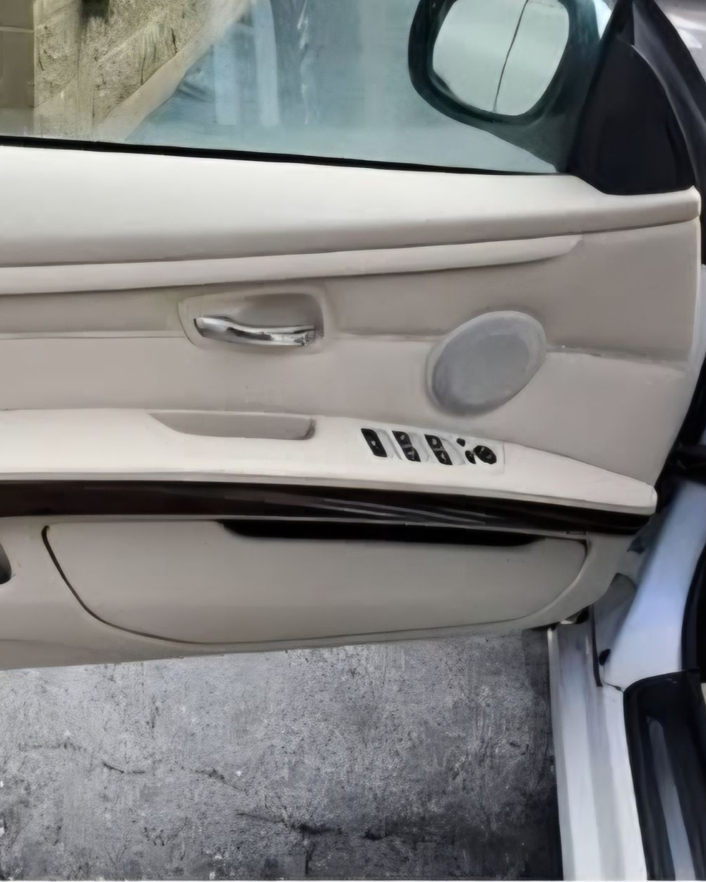 A yellow sports car is parked in a garage.