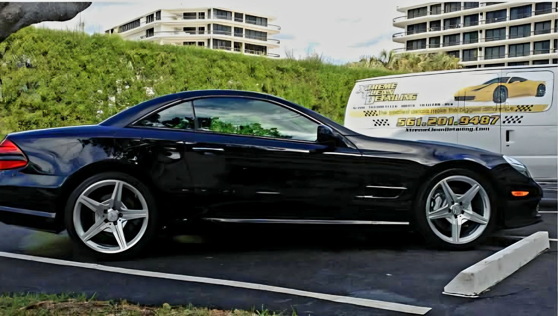 A close up of water drops on the hood of a car