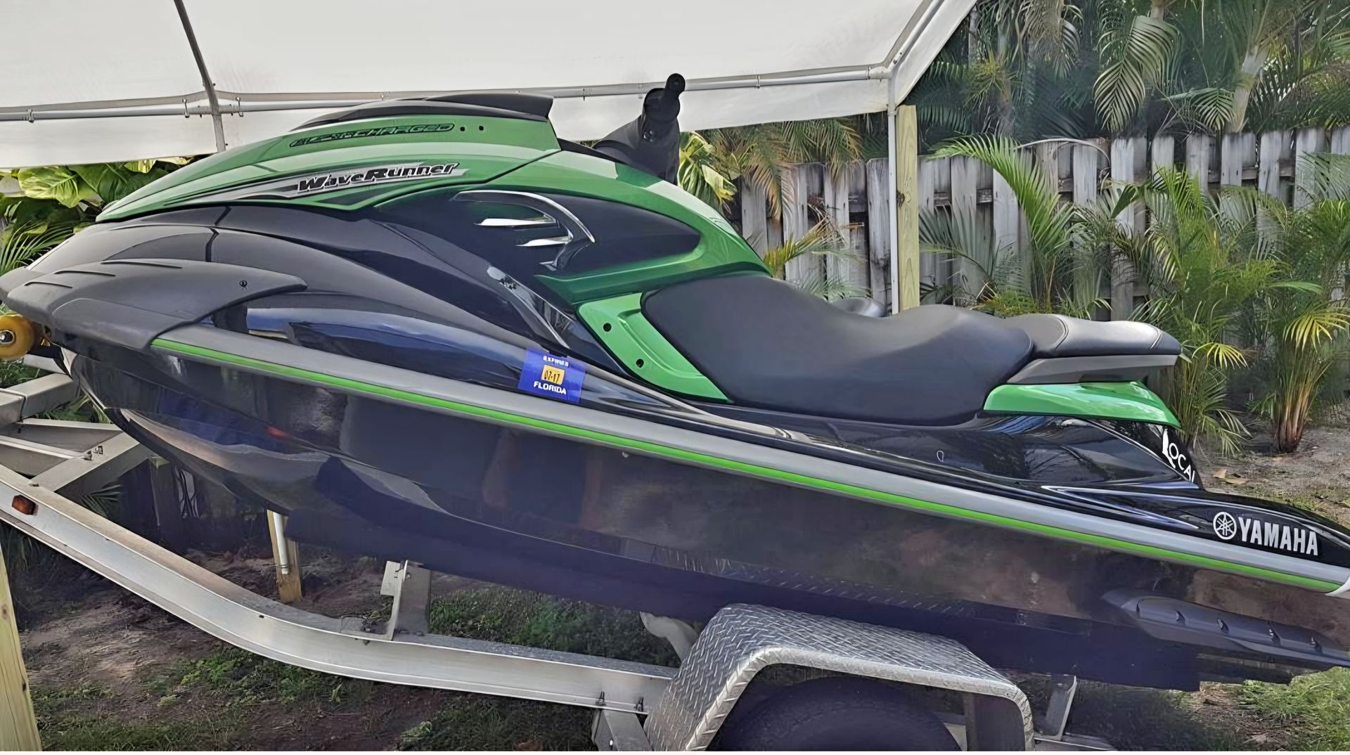 A close up of water drops on the hood of a car