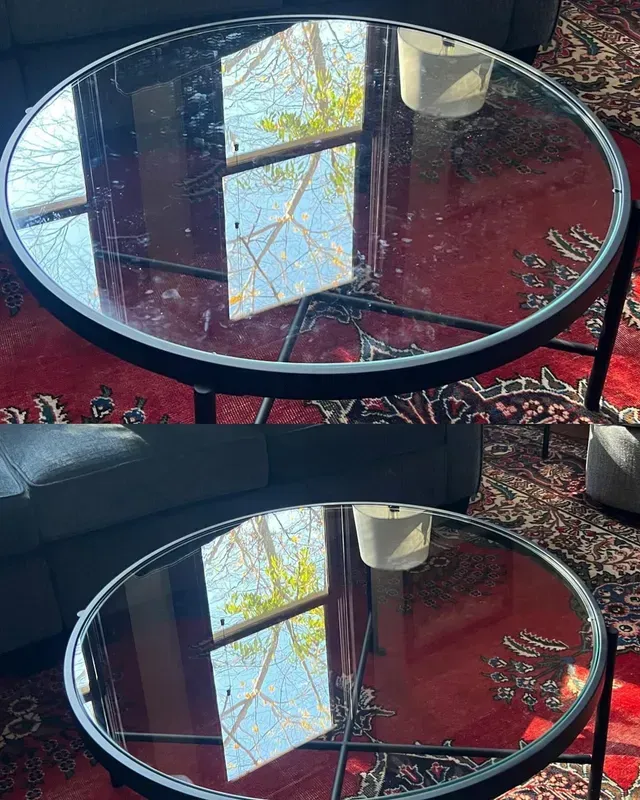 Top and bottom views of a round glass-topped coffee table with black frame on a red rug. Window reflection visible.