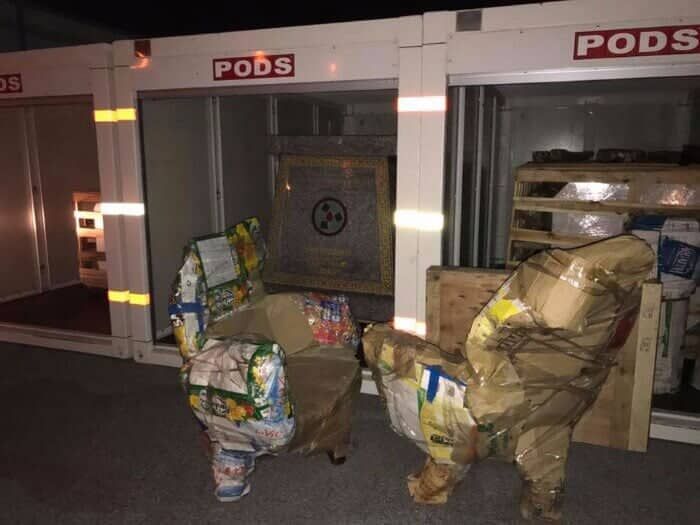 A room with a sign that says pods on it 28.4845° N, 81.2519° W