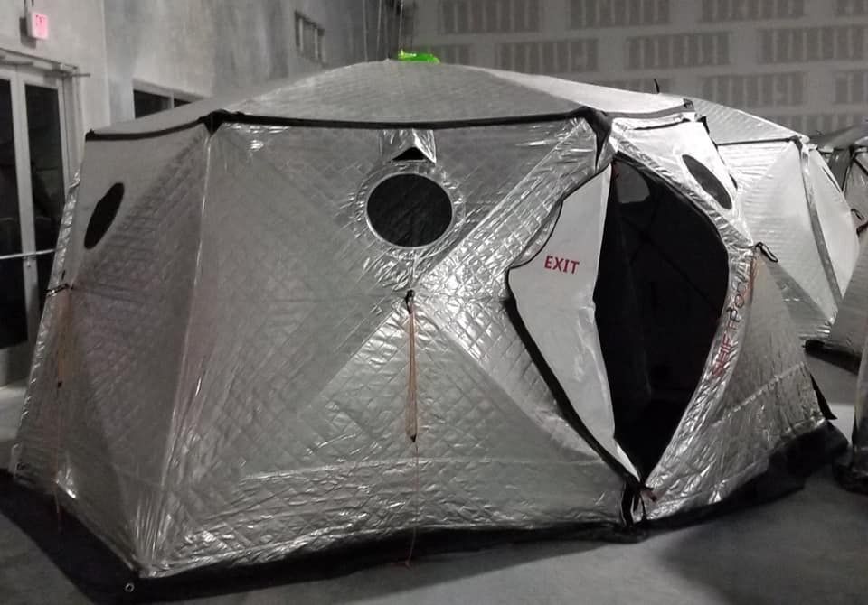 A tent with the word exit on it 28.4845° N, 81.2519° W