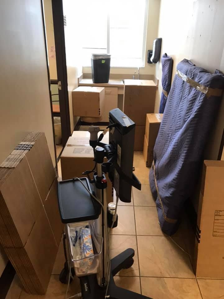 A room filled with boxes and a computer monitor. 28.4845° N, 81.2519° W