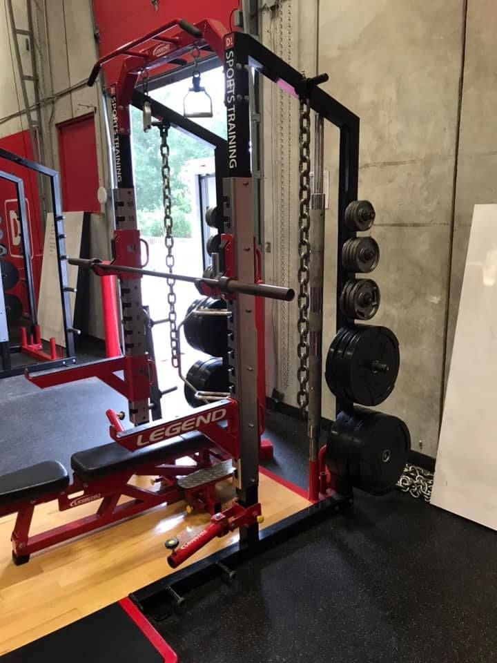 A gym with a squat rack and a bench. 28.4845° N, 81.2519° W