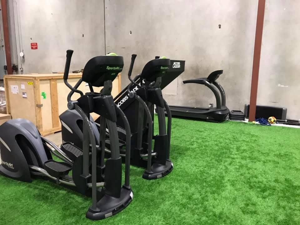 A row of ellipticals and treadmills in a gym. 28.4845° N, 81.2519° W