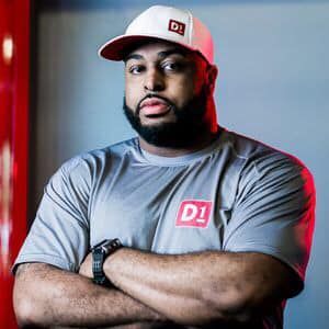 A man with a beard and a hat is standing with his arms crossed. 28.4845° N, 81.2519° W