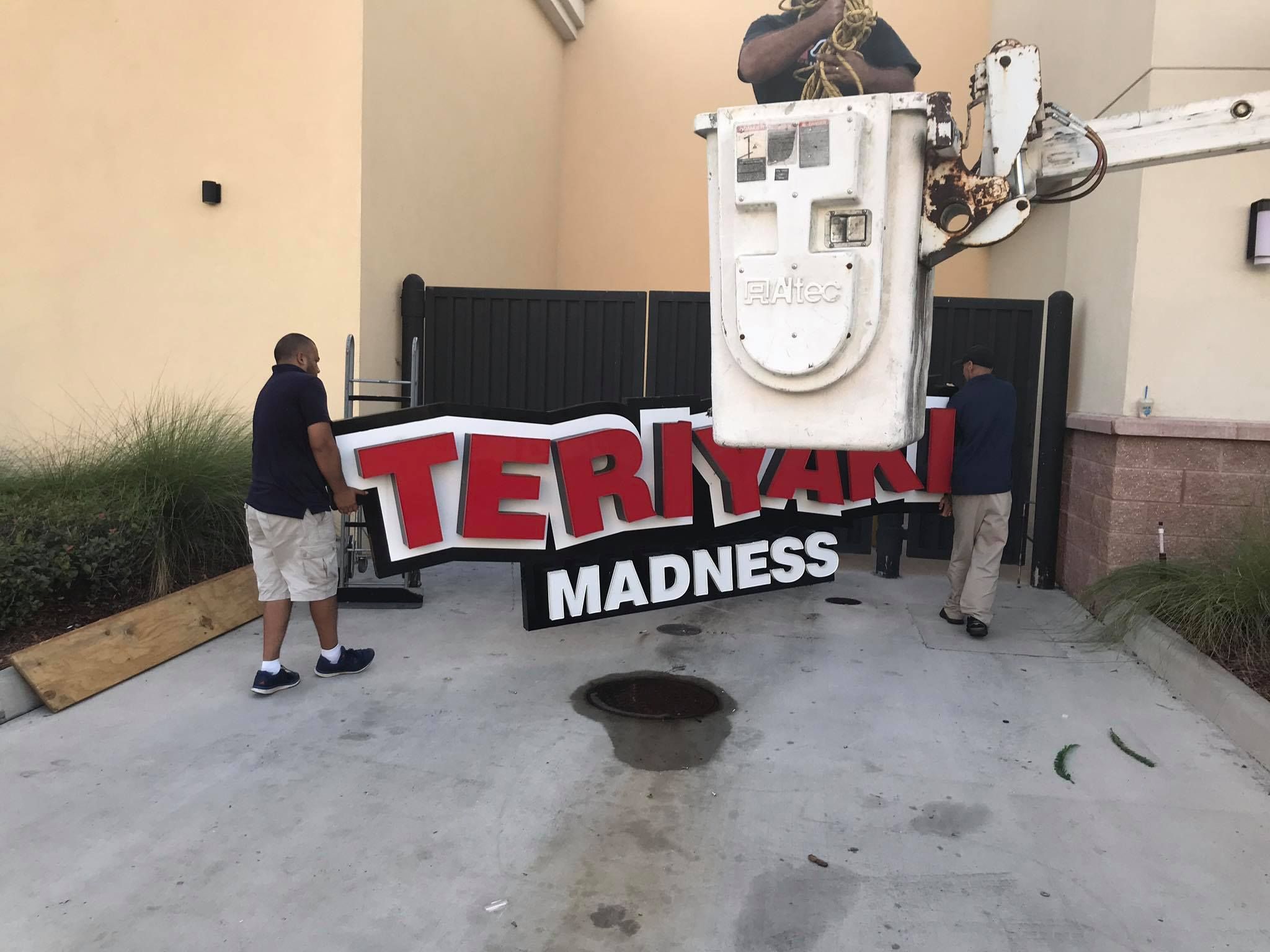A sign that says teriyaki madness on it 28.4845° N, 81.2519° W