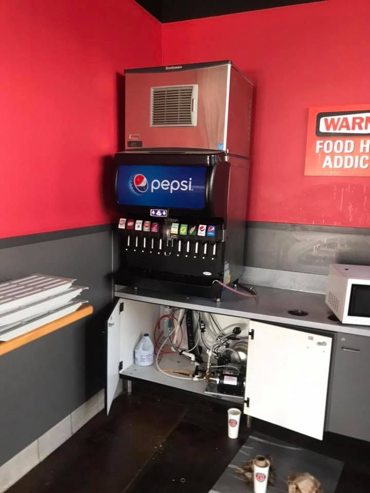 A Pepsi machine is sitting on a counter in a restaurant 28.4845° N, 81.2519° W