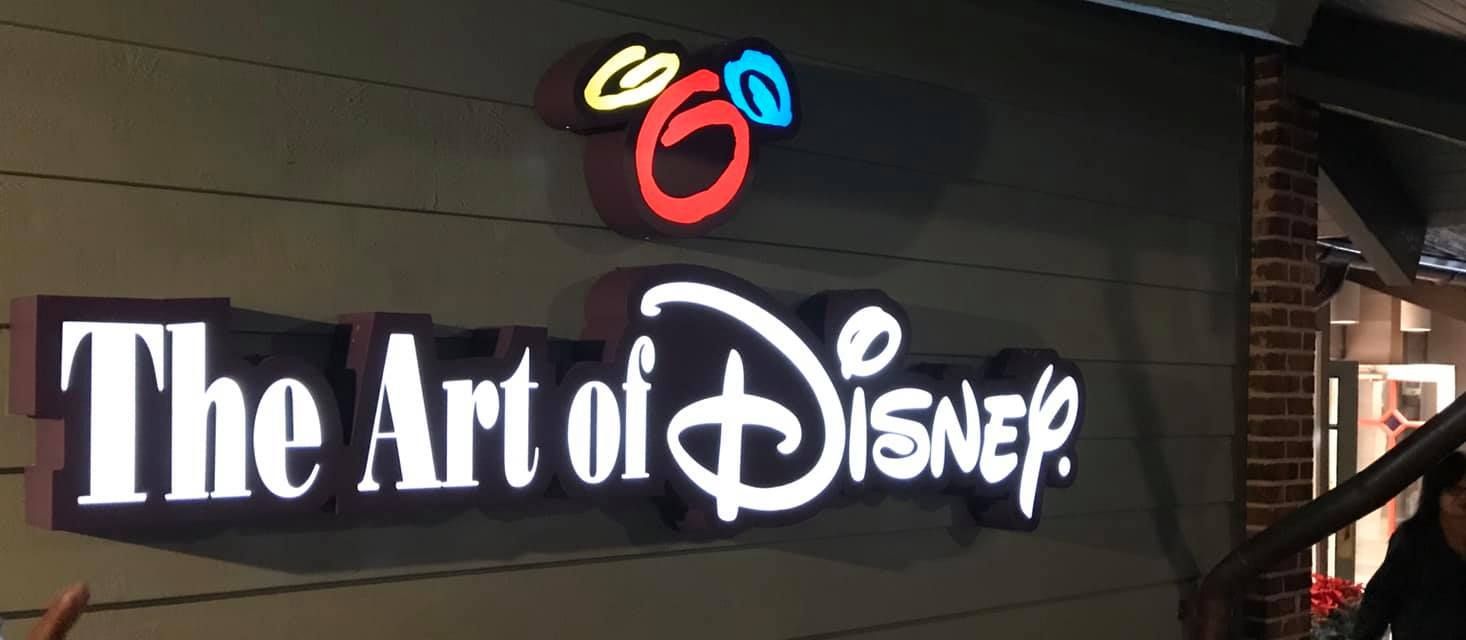 A sign that says the art of Disney on it 28.4845° N, 81.2519° W