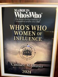 A book titled who 's who women of influence by candace m. butler