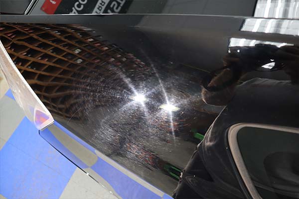 a before picture of swirl marks on a cars paint