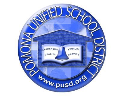 Blue circular seal of the Pomona Unified School District featuring a school building icon, a bell, and four core values.