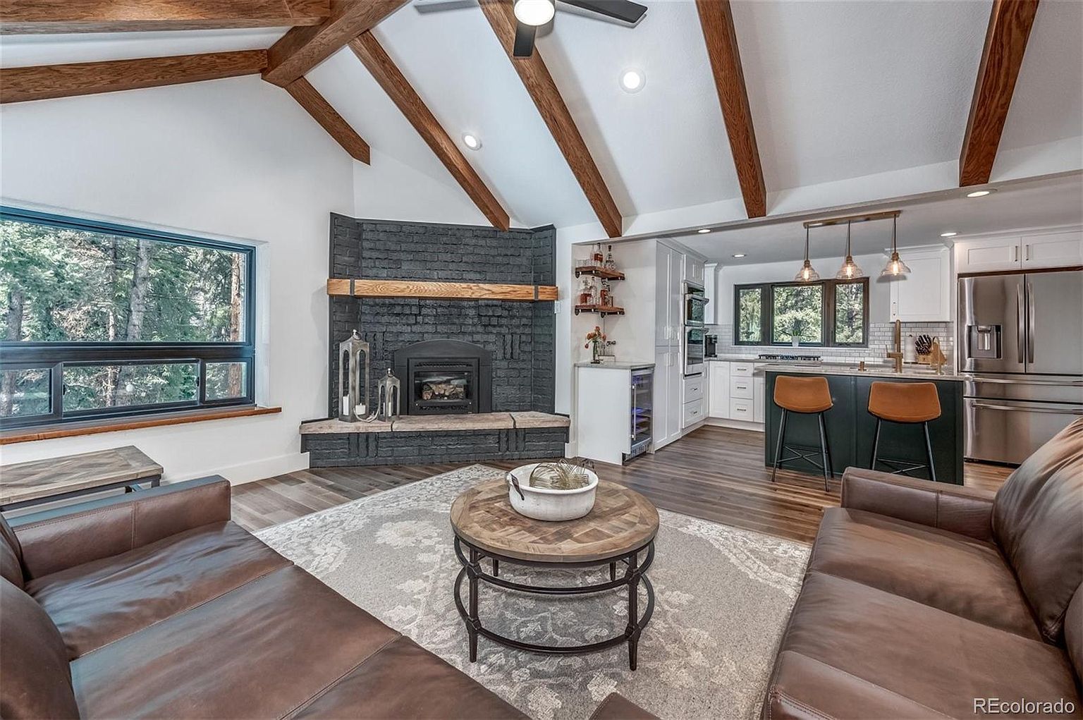 A living room filled with furniture and a fireplace.