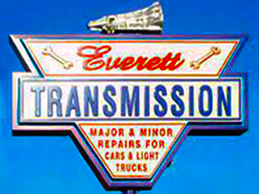 A sign for everett transmission major and minor repairs for cars and light trucks