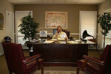 Florida Lawyer ─ Attorney Kouskoutis At His Desk In Tarpon Springs, FL