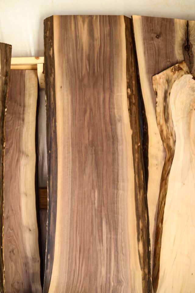 A pile of bricks of wood stacked on top of each other