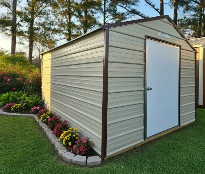 Tan metal garden shed with white door, surrounded by flowers on a manicured lawn.