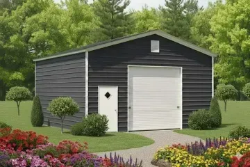 Dark gray detached garage with white doors, surrounded by green lawn and colorful garden flowers.