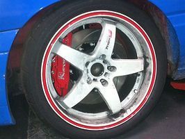 Close Up of a Car Wheel With a Red Rim — Darwin Auto Mobile Care in Woolner, NT