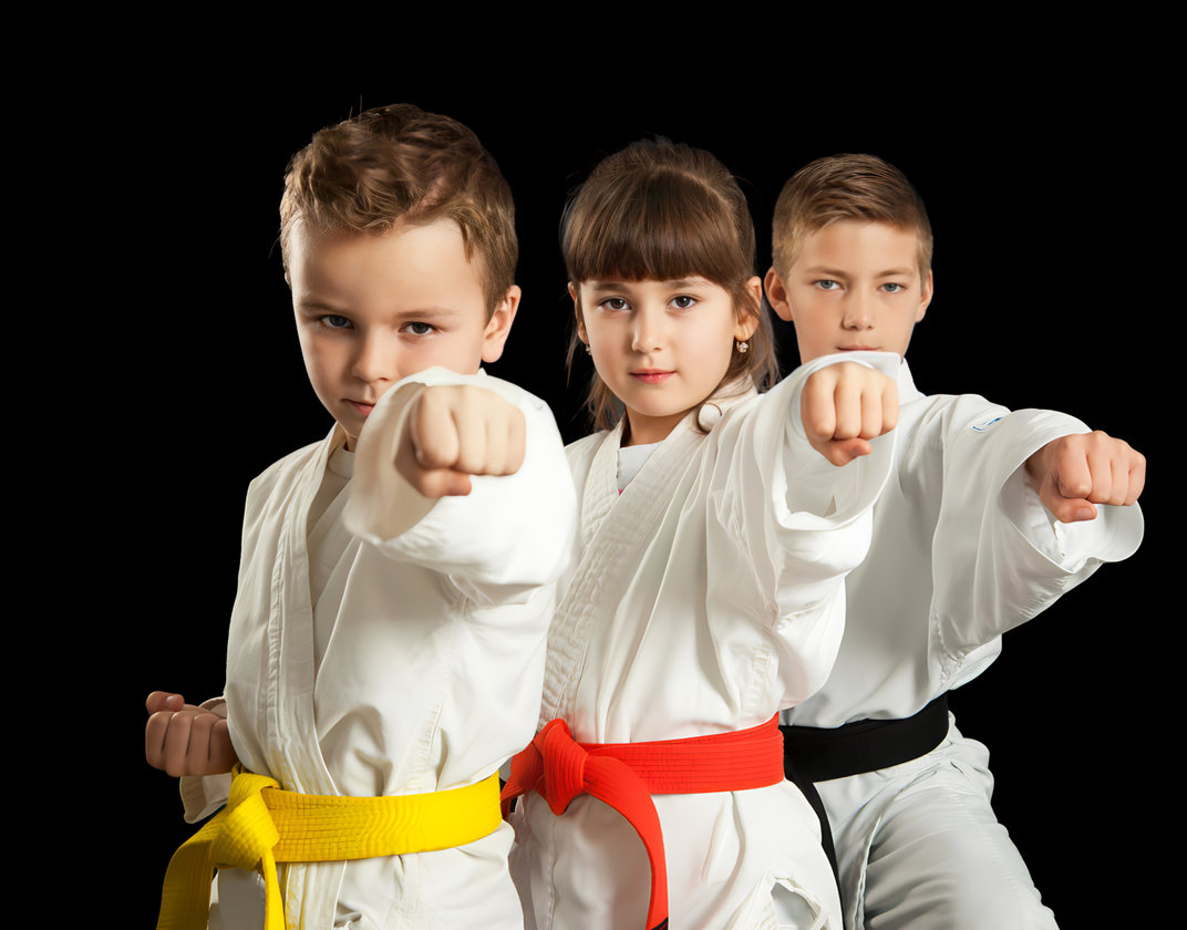 A group of young children are practicing karate together.