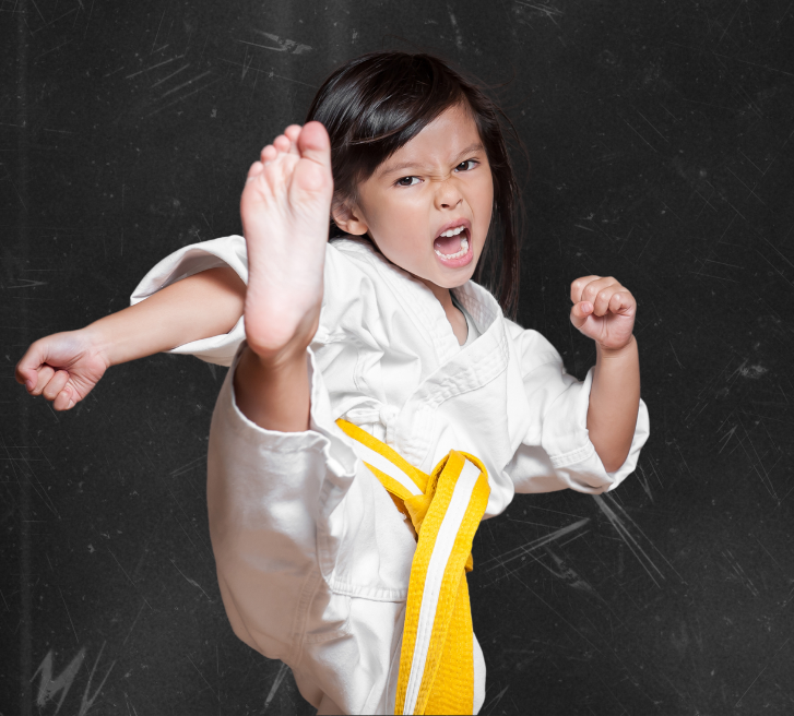 A group of young children are practicing karate together.