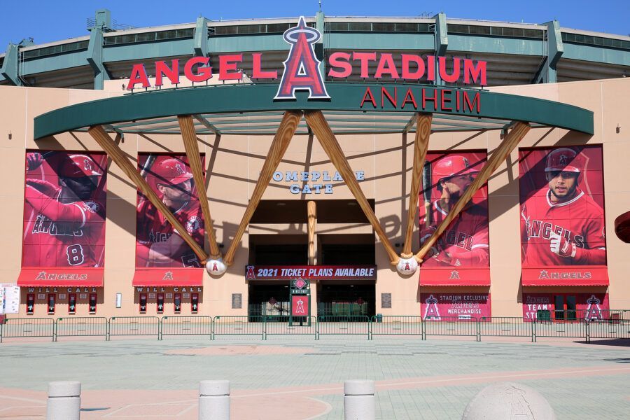 Angel Stadium Anaheim entrance with red Angels signage and banners of baseball players.