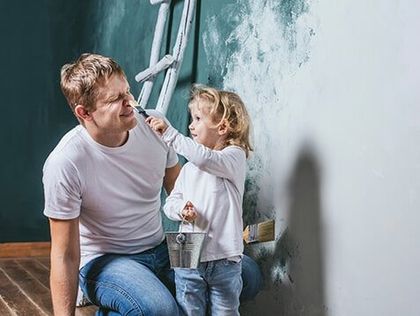 Happy Father and his Daughter Painting the Wall — Building Materials in Avenel, NJ