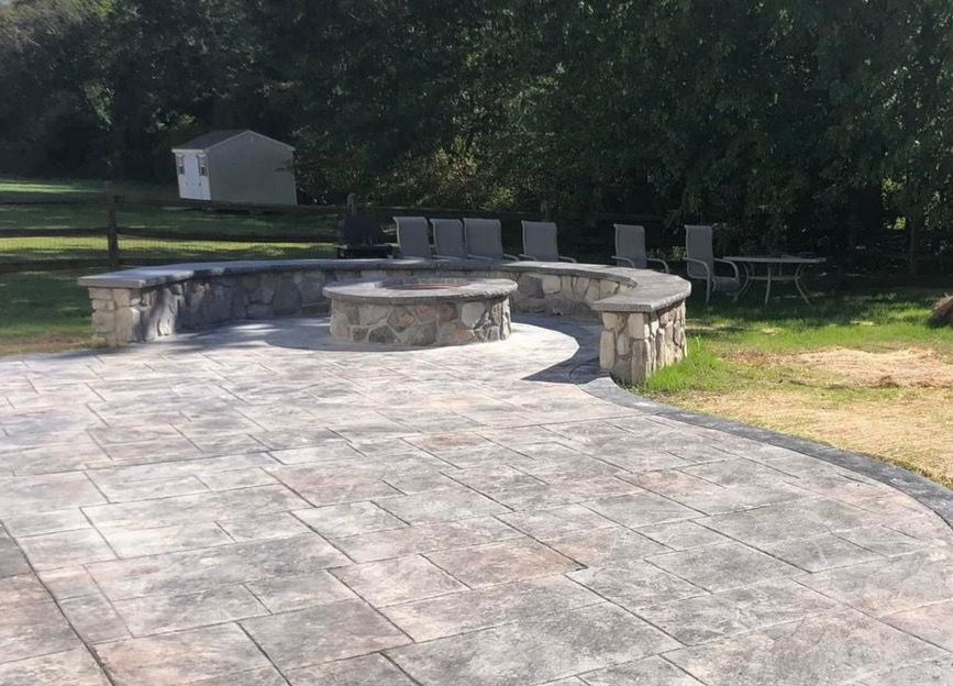 stamped concrete patio and firepit installed in Frederick MD