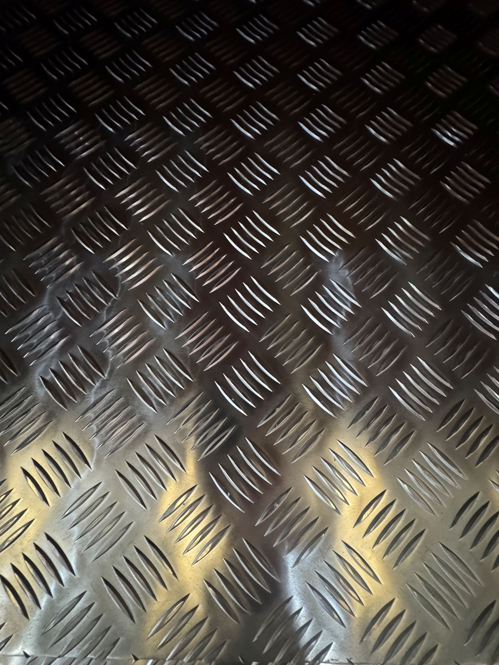 An assortment of steel box section ends stacked